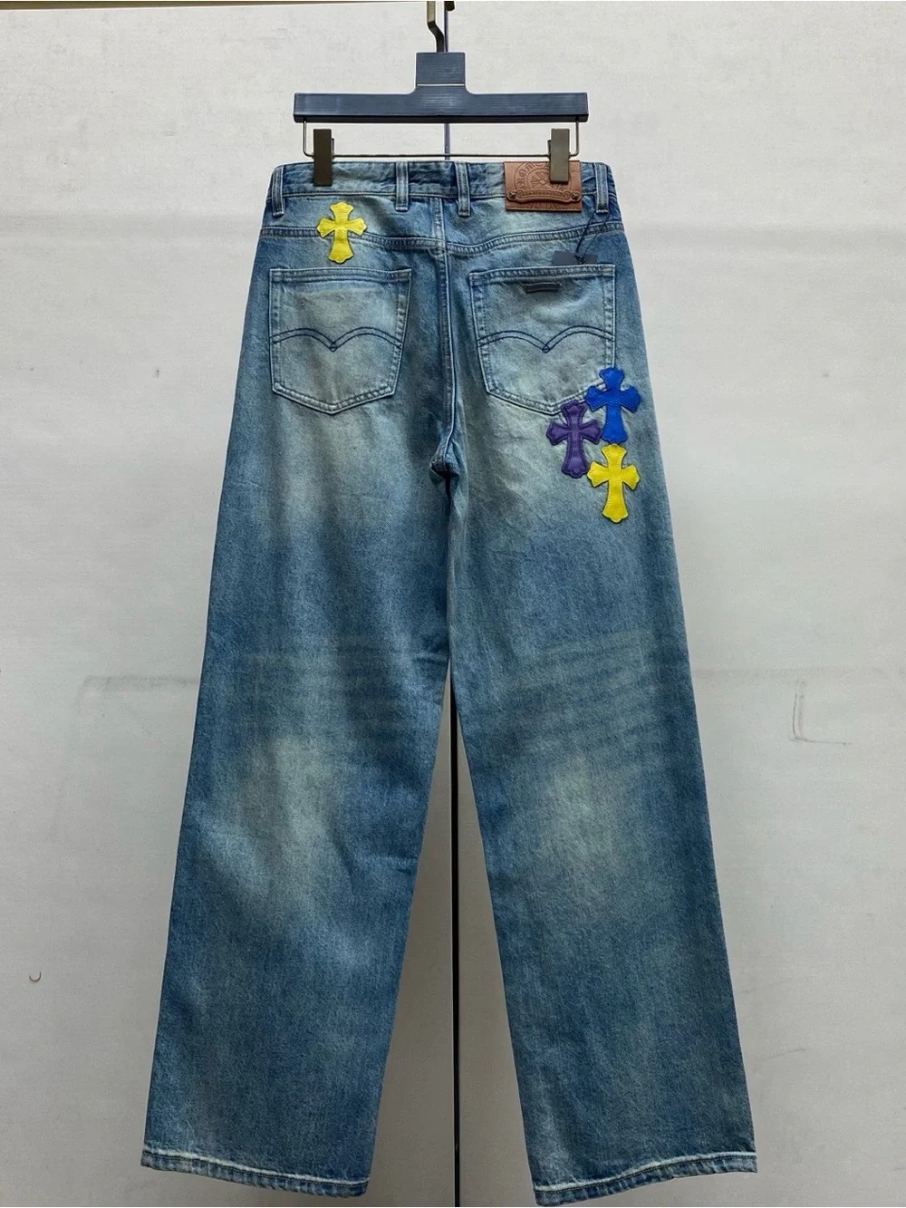 Chrome Hearts Blue Wide-Leg Jeans with Purple & Yellow Cross Appliqués
